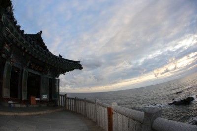 Naksansa temple sitting in front of the sea on a cloudy day